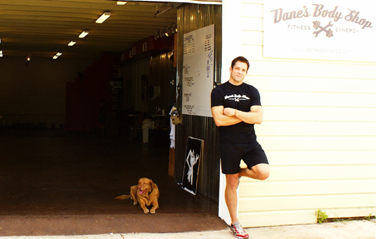 Dane and his dog Cede in front of Dane's Body Shop